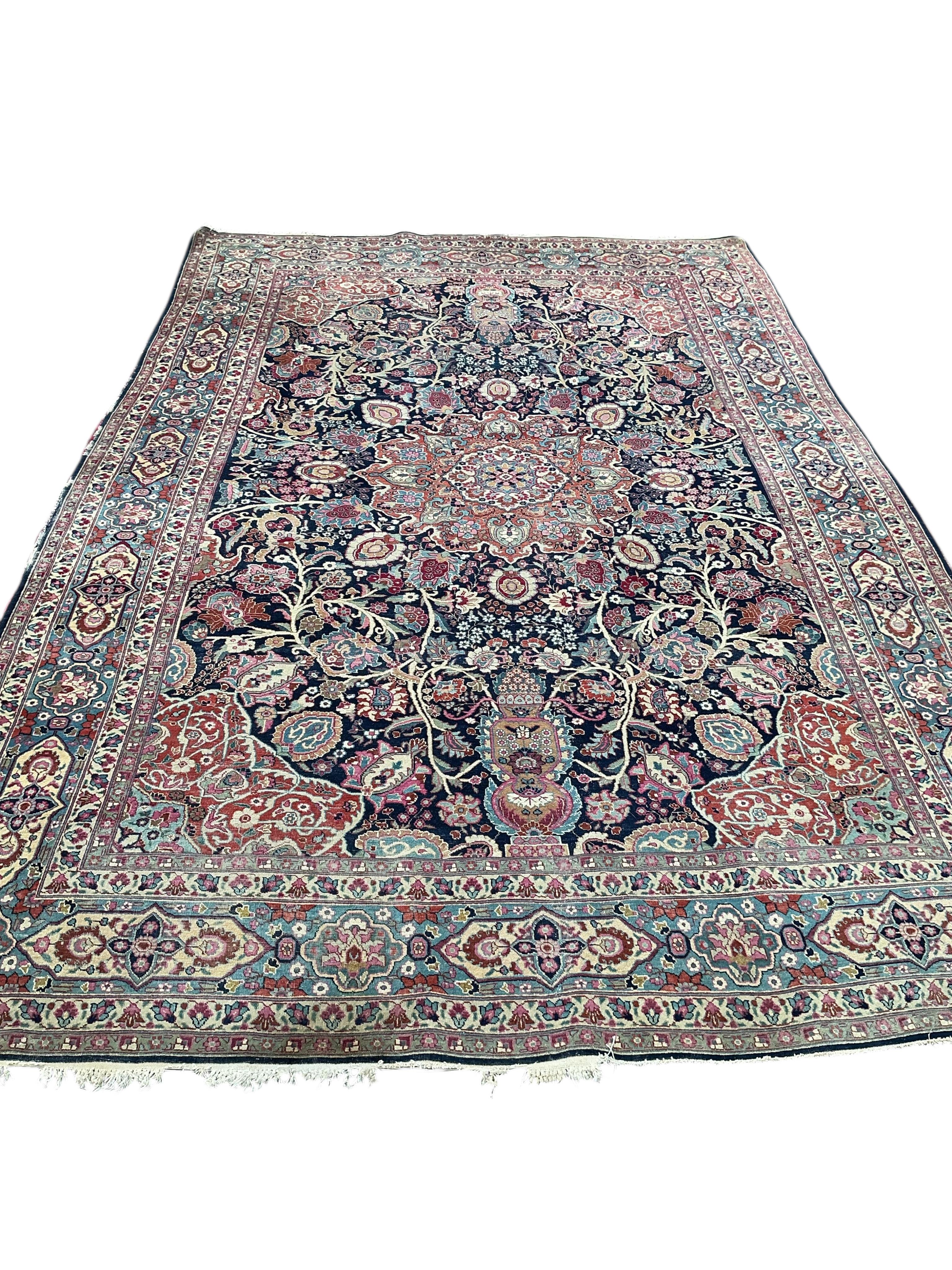 An early 20th century Kashan blue ground carpet, 315 x 206cm